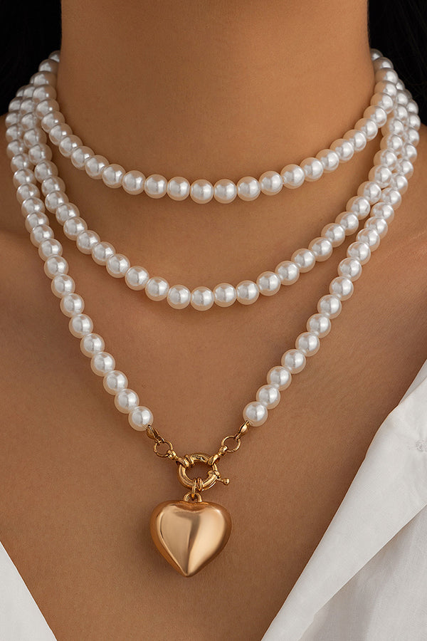 Collier multi-couches cœur et perles élégant