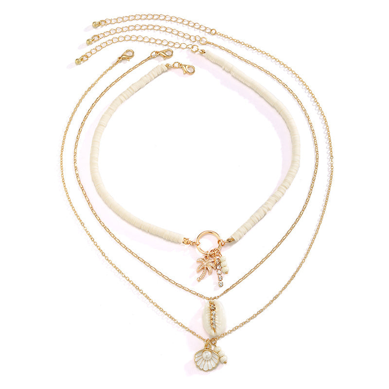 Collier multicouche avec perles et coquillages