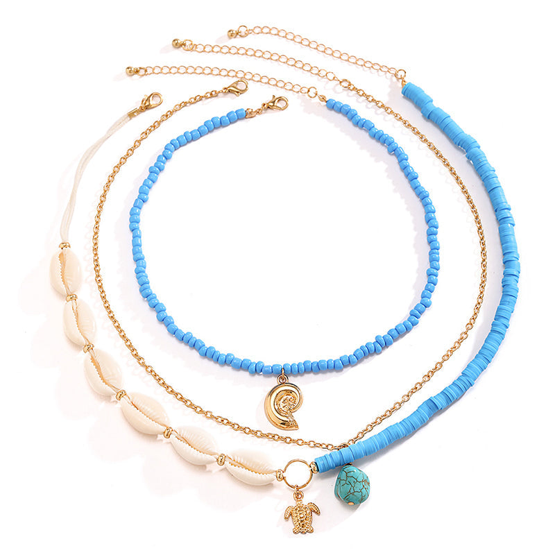 Collier multicouche avec perles et coquillages