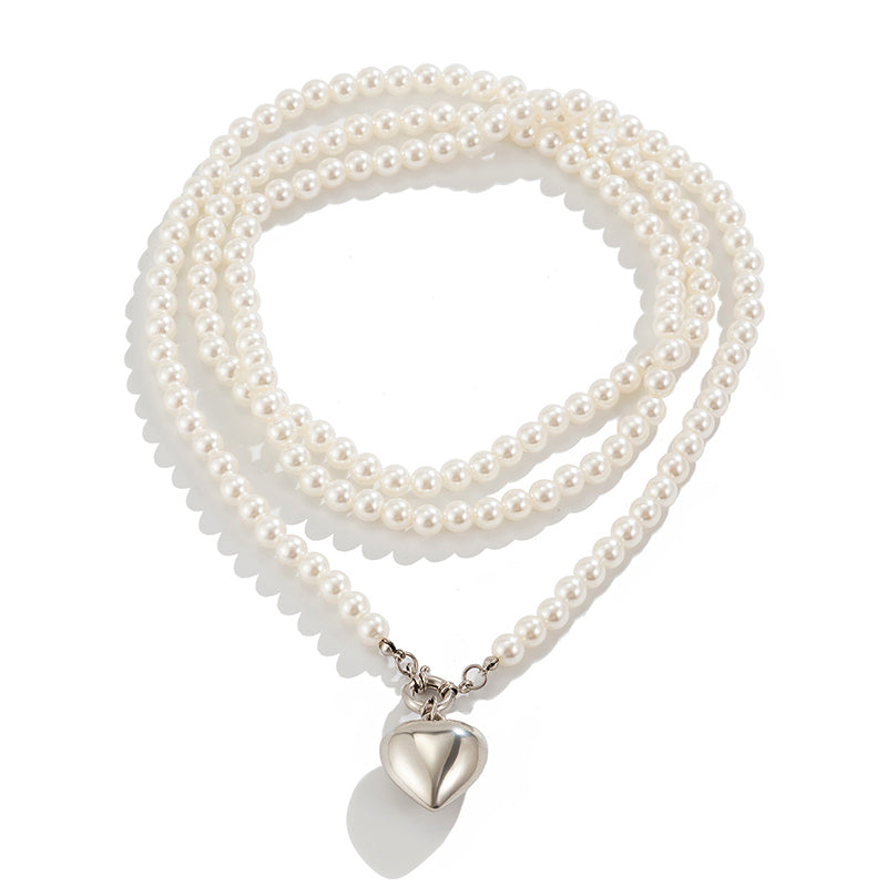 Collier multi-couches cœur et perles élégant
