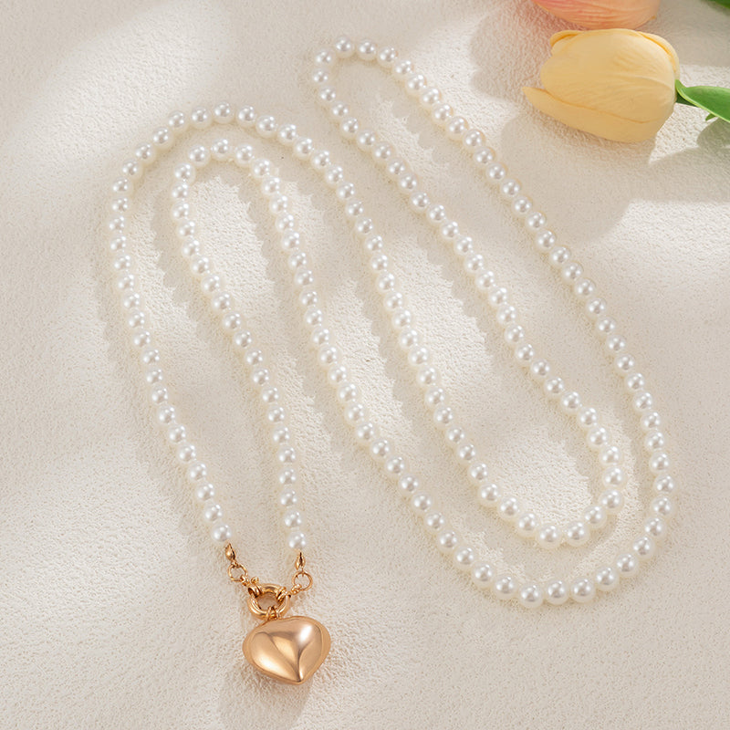 Collier multi-couches cœur et perles élégant